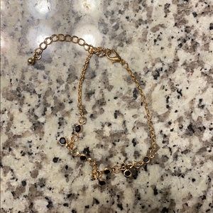 gold anklet with black jewels